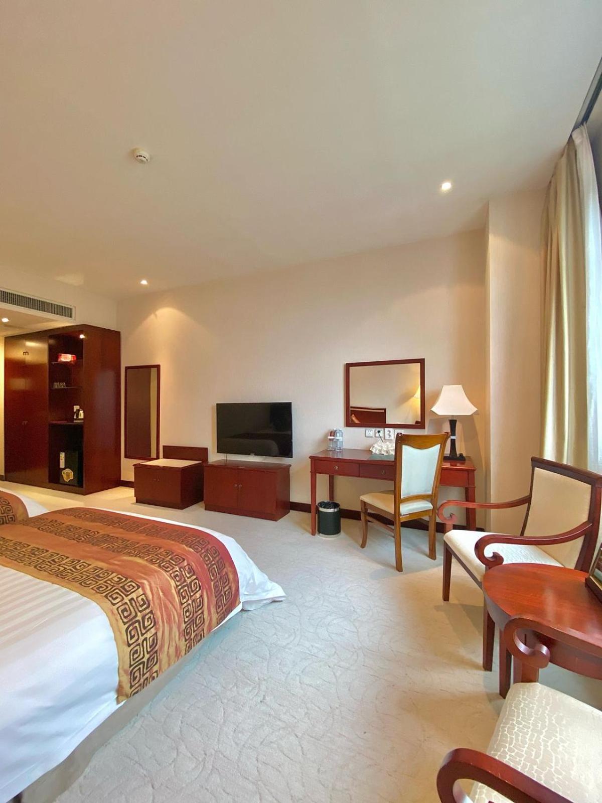 Пекин Палас Soluxe Hotel Astana Экстерьер фото A room at the hotel